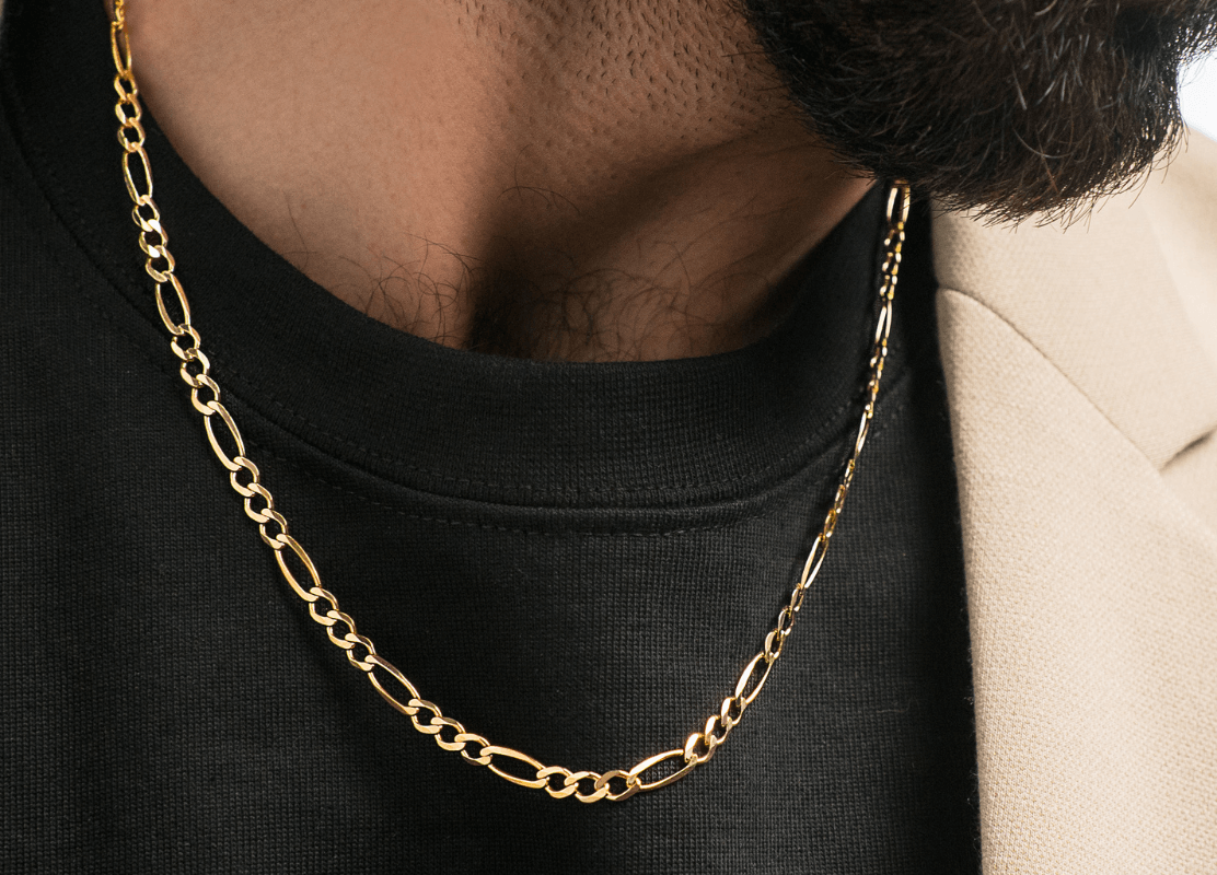 young man wearing black t-shirt and modern gold chain
